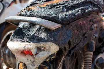 Terrorists set fire to motorbikes on a street in the city.