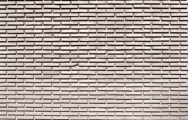 Full frame square brick wall for background.