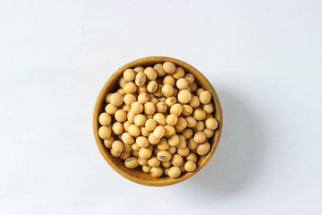 Top view of soy beans background in mini wooden bowl. The benefit of soy beans so much and popular for made some soy milk. This is the important ingredients for vegtarian.