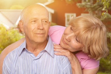 Portrait of happy senior couple smiling  in park