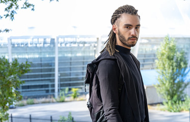 Portrait of a young man with dreadlocks hairstyle.