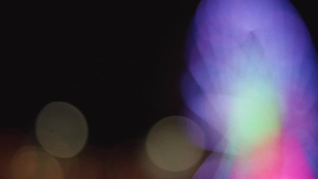 movimento su luci bokeh di ruota panoramica al luna park