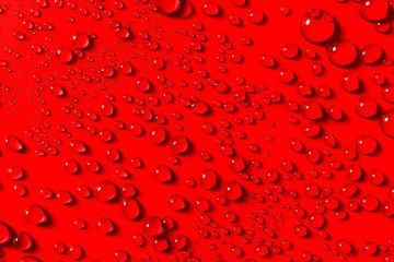 Close up Colorful festive red background with water drops