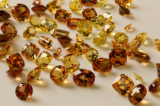 Colorful yellow, orange, brown gemstones on white background