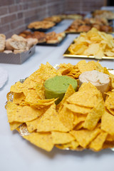 Table of appetizers with mexican nachos
