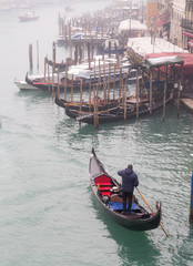 Obraz premium gondolas in venice on a cold grey morning.