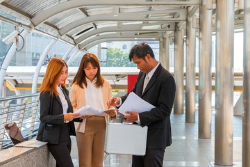 Businesspeople using laptop for consulting about his project wit