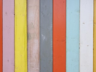 Texture of coloured wooden surface as background