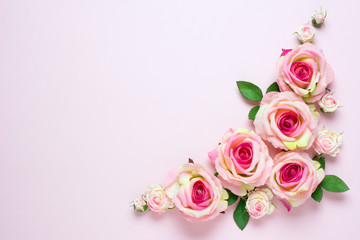 Obraz na płótnie Canvas Beautiful wedding background with pink rose flowers on light pink background