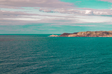 Fototapeta premium Beautiful summer day landscape abandoned artnature coastal defense North Teriberka, Barents sea view.