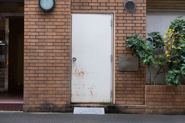sidewalk by street wall & door