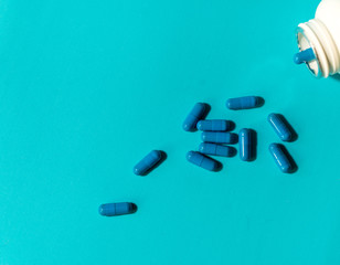  blue pills on color background