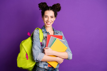 Turned photo of smart cool high-school girl hold note books want study get information knowledge on...