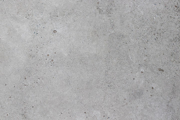 Concrete gray texture with small dots and cracks