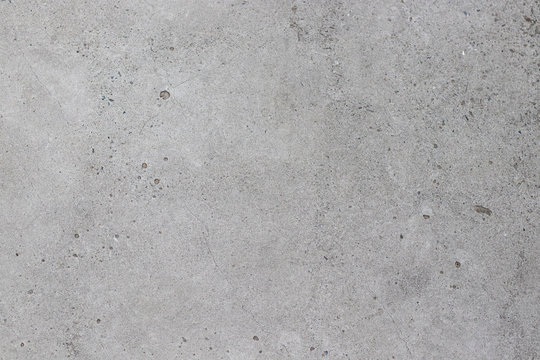 Concrete gray texture with small dots and cracks