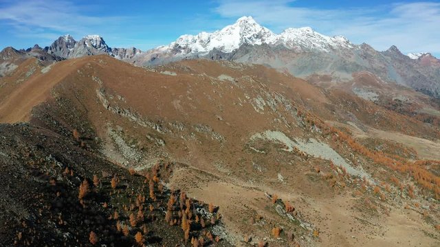 Aerial 4K - Valtellina (IT) - Autumnal view of Mount Disgrazia and Peak Badile from the Arcoglio alp 