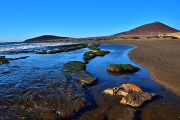 El Medano, rocks and puddles at low tide