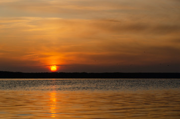 Fototapeta na wymiar Sun rising over the lake, sun rise