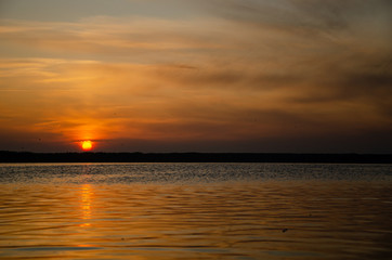 Fototapeta na wymiar Sun rising over the lake, sun rise