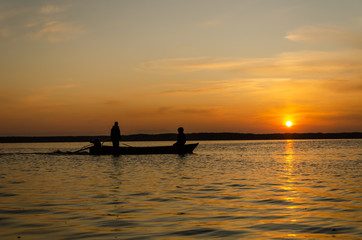 Naklejka na ściany i meble The fishermen and boat silhouette