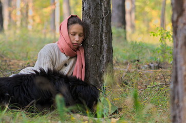 girl wanderer with a dog