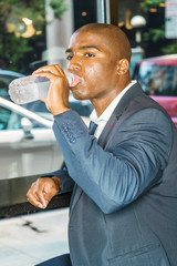 Young Handsome African American Businessman with afro short hair, traveling in New York City,...