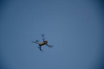 Drone copter with digital camera on the sky,