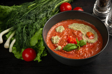 tomato cream soup in a black plate