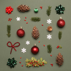 Christmas decoration set flat lay on green background.  Christmas, winter holiday, new year concept. 