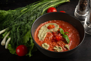 tomato cream soup in a black plate