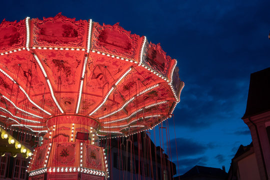 A Ferris wheel is an amusement ride consisting of a rotating upright wheel with multiple passenger-carrying components attached to the rim in such a way that as the wheel turns, they are kept upright,