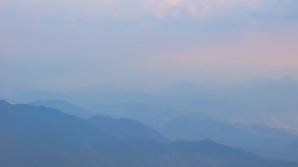 Fototapeta premium Abstact of landscap of chain mountain / peaks in misty or foggy day in soft focus