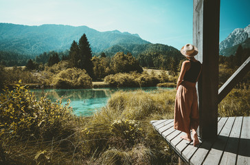 Woman enjoying freedom on nature outdoors. Travel Slovenia Europe.