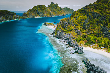 Aerial view of jutted lime stone cliff karst mountains on island tour exploration tour of...