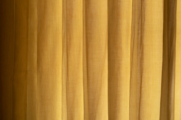 Obraz premium Close up yellow Curtain with morning sunlight.