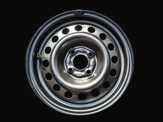 black metal car wheel with round holes