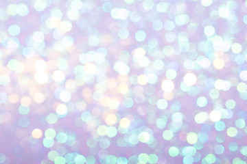 Pastel festive background with sparkles in the bokeh. The concept of the celebration, the day of St. Valentine, New Year, birthdays, ceremonies, events, etc.