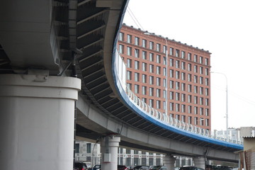 Obraz premium large transport overpass by the river on a cloudy day