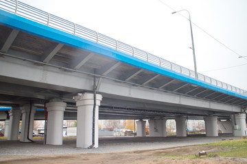 large transport overpass by the river on a cloudy day