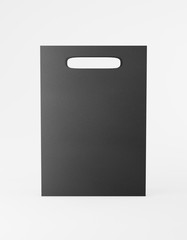 Eco packaging mockup bag kraft paper with handle front side. Standard medium black template on white background promotional advertising. 3D rendering