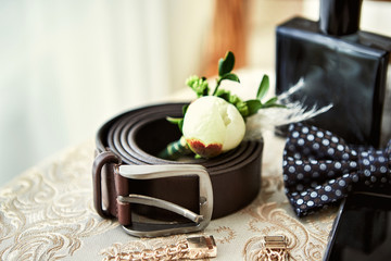 different accessories of a businessman for creating a style of a people lie on a wooden background