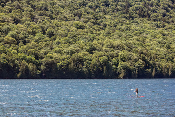 Fototapeta na wymiar Summer Paddler on New England Lake