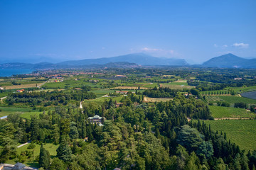 Fototapeta na wymiar Panoramic view of the meadows and mountains of Lake Garda