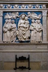 Fototapeta na wymiar FLORENCE, TUSCANY/ITALY - OCTOBER 19 :Madonna Enthroned, work by Luca della Robbia, Medici Chapel Santa Croce Church in Florence on October 19, 2019
