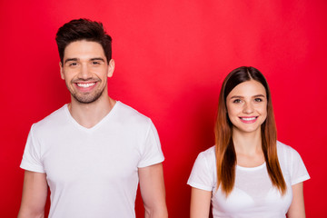 Photo of cheerful positive cute nice couple standing side by side smiling toothily looking at you isolated vibrant color background