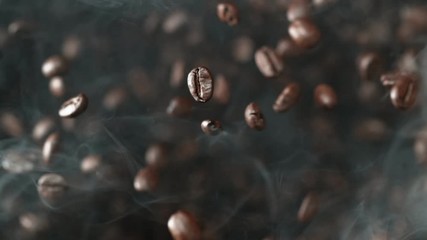 Super slow motion of flying coffee beans in speed ramping. Filmed on high speed cinema camera, 1000 fps.