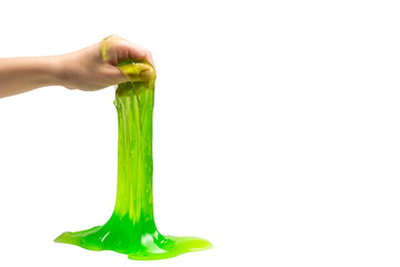 Green slime toy in woman hand isolated on white.