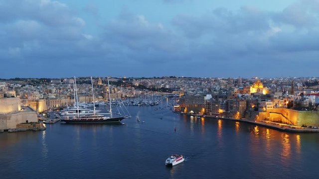 Grand Harbour at dusk in Malta, city of Birgu - Vittoriosa and Senglea, view from above, Mediterranean Sea natural bay.