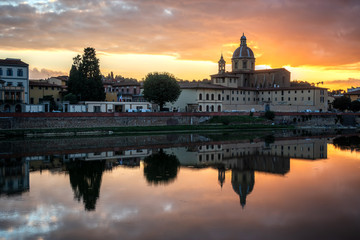 Fototapeta na wymiar FLORENCE, TUSCANY/ITALY - OCTOBER 19 : View of buildings along the River Arno at dusk in Florence on October 19, 2019