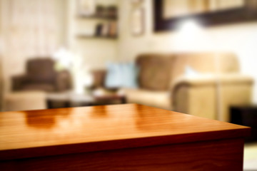 Wooden corner table background of free space for your decoration and blurred home interior 
